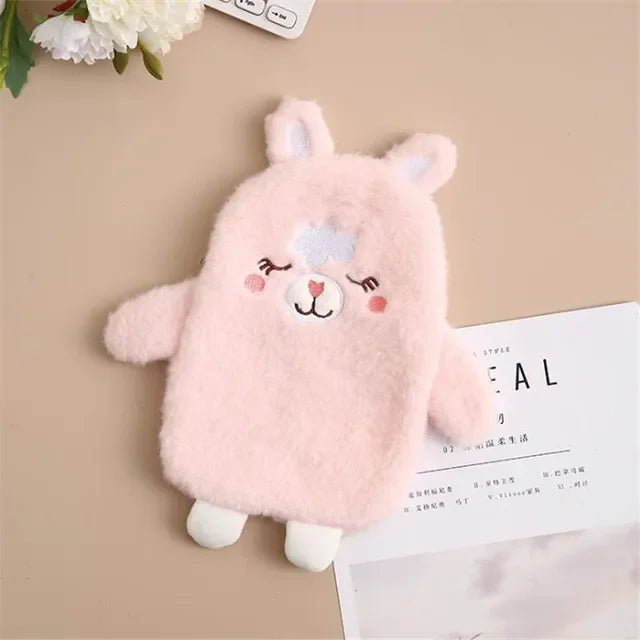 A pink fluffy plush toy resembling a lamb is shown against a neutral background.