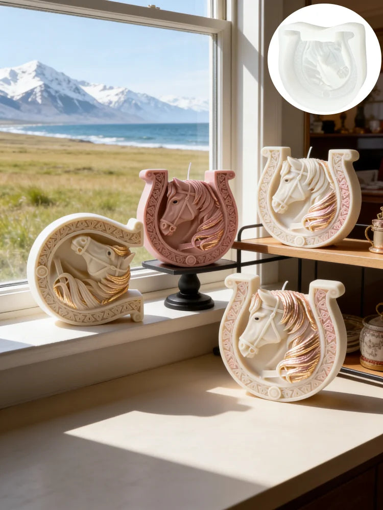 A collection of pink and white ceramic candle molds shaped like horses with Celtic knot designs displayed on a windowsill.