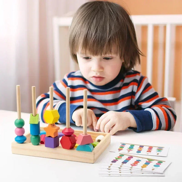 A young child is playing with a wooden shape matching puzzle featuring colorful geometric blocks on a light table.