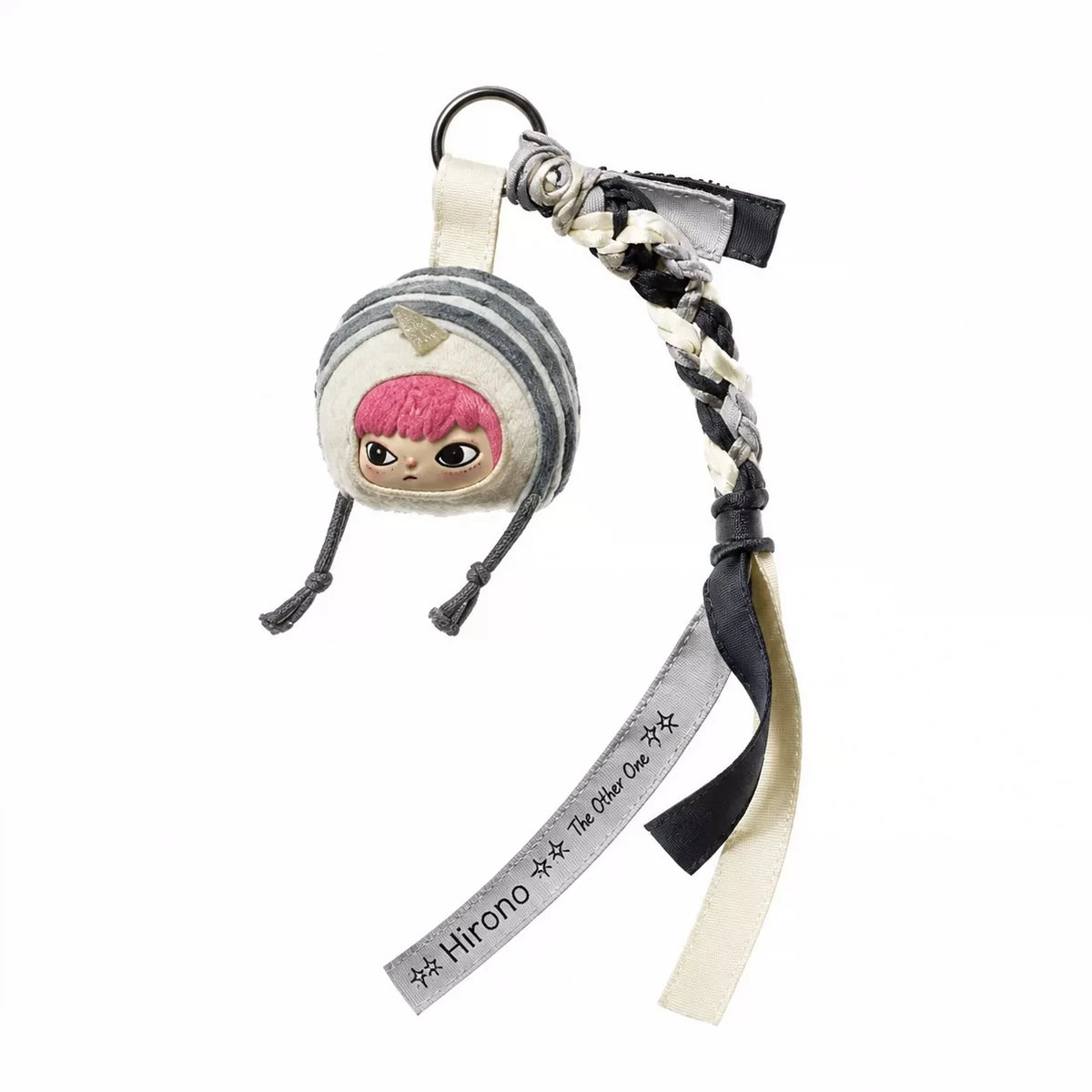 A blind box keychain featuring a character with pink hair and a round head, attached to a braided strap.