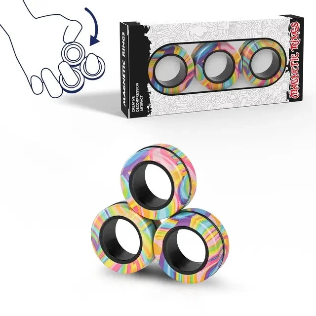 A box of magnetic fidget rings with colorful, marbled designs and three individual rings displayed below.