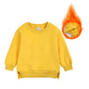 A yellow kids pullover hoodie with a hood and sleeves is shown, emitting an orange flame effect.