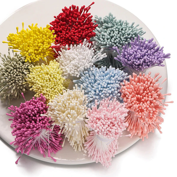 A collection of mini pearl stamen floral decorations in various shades including yellow, red, green, purple, and pink arrange