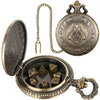 A brass steampunk dragon pocket watch dice case with an open lid and a hanging chain.