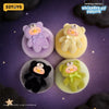 A collection of four fluffy teddy bear-shaped blind box toys in purple, yellow, black, and green against a purple background.