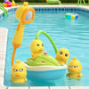 A yellow duck bath toy is floating in a blue swimming pool with other colorful inflatable toys.
