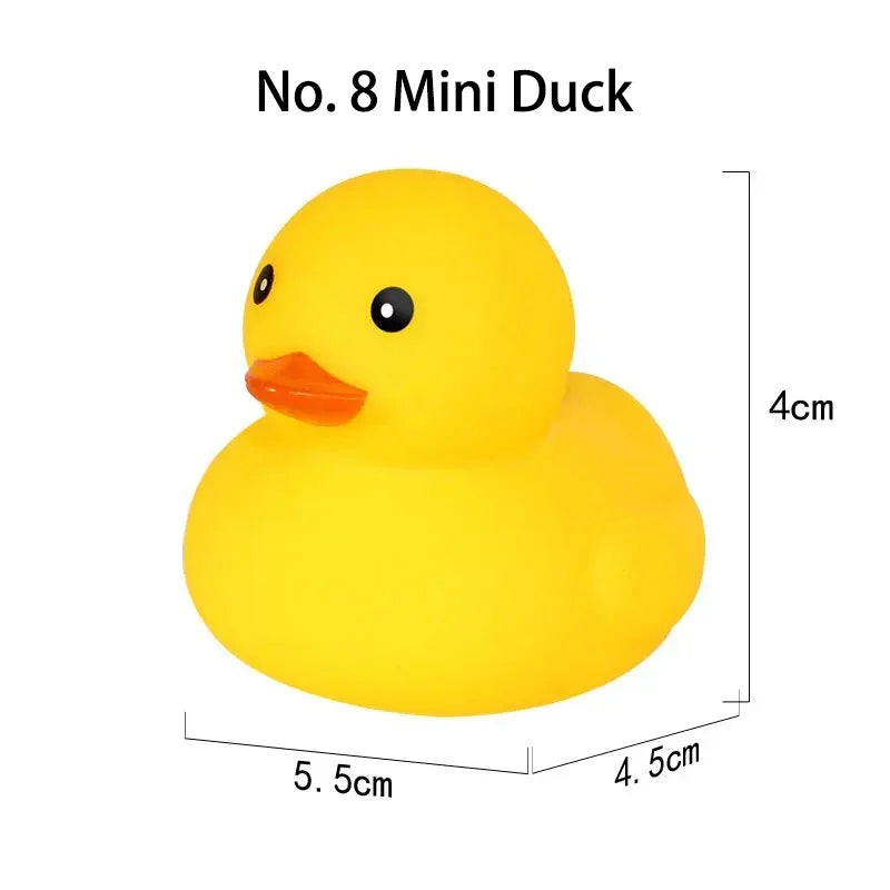 A yellow mini rubber duck with an orange beak and black eyes.
