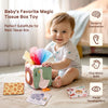 A baby is playing with a fabric tissue box toy designed for sensory exploration and fine motor skill development.