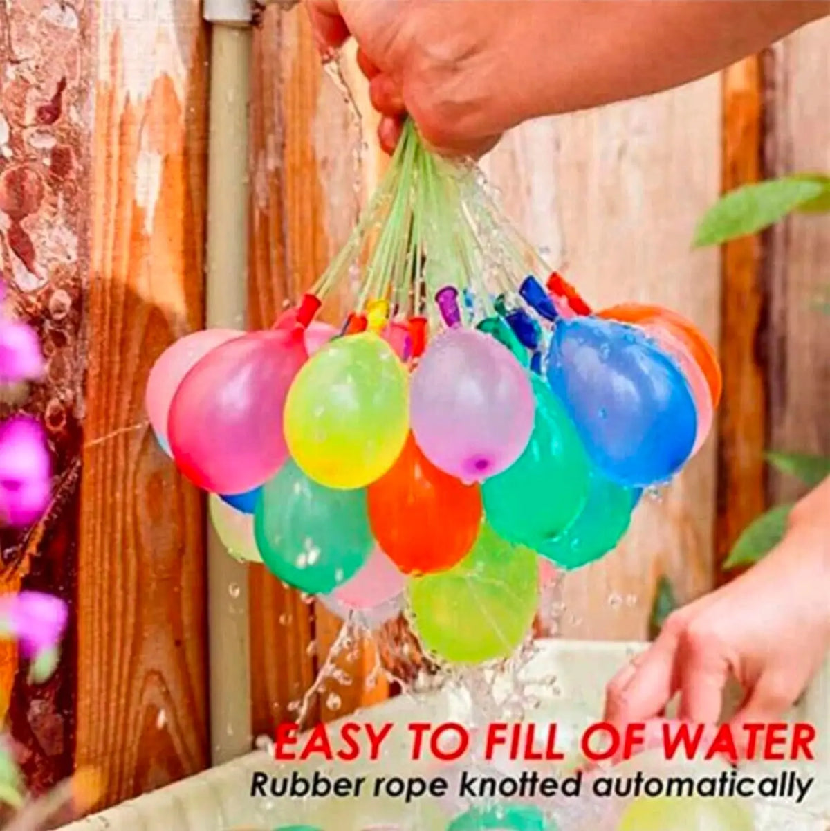 Rubber rope knotted water balloons being filled with water
