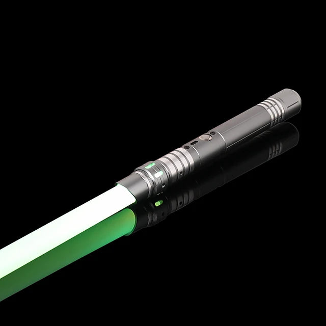 A black lightsaber with a green blade and metallic accents is shown against a black background.