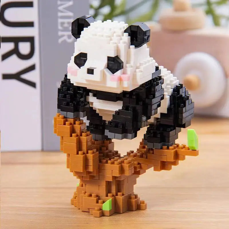 A mini panda building block set featuring black and white blocks with an orange tree base.
