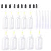 A set of clear squeeze bottles and blunt needle tips for precision dispensing.