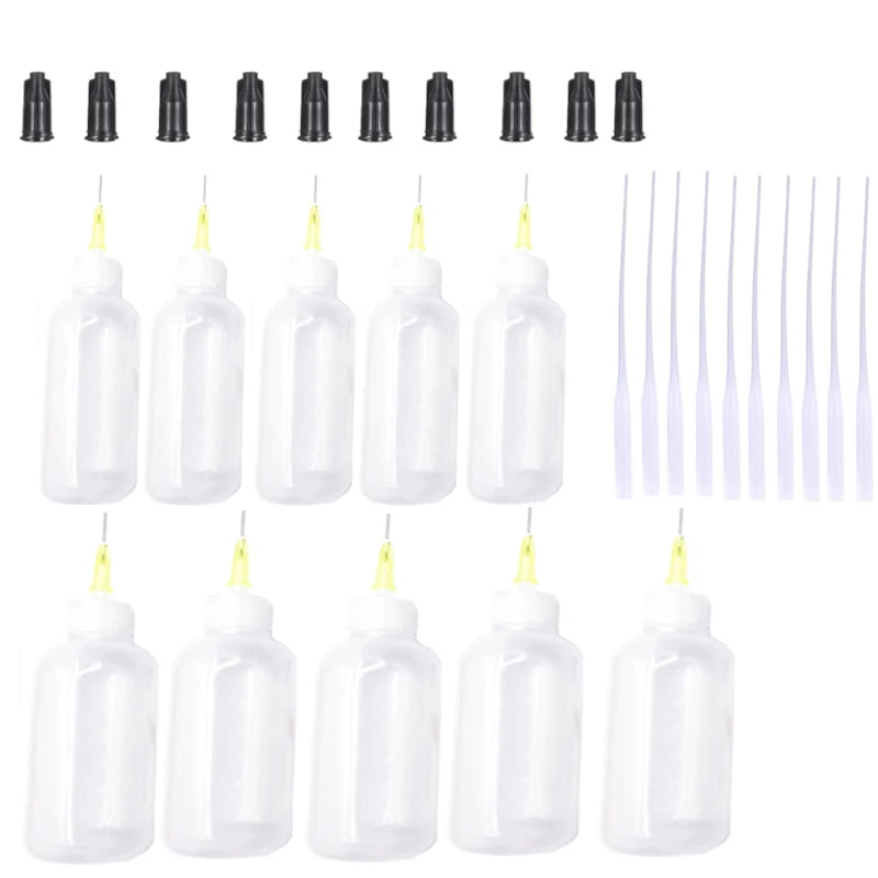 A set of clear squeeze bottles and blunt needle tips for precision dispensing.