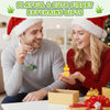 A man and woman smiling while holding a yellow duck and frog clicker keychain gift in a box.