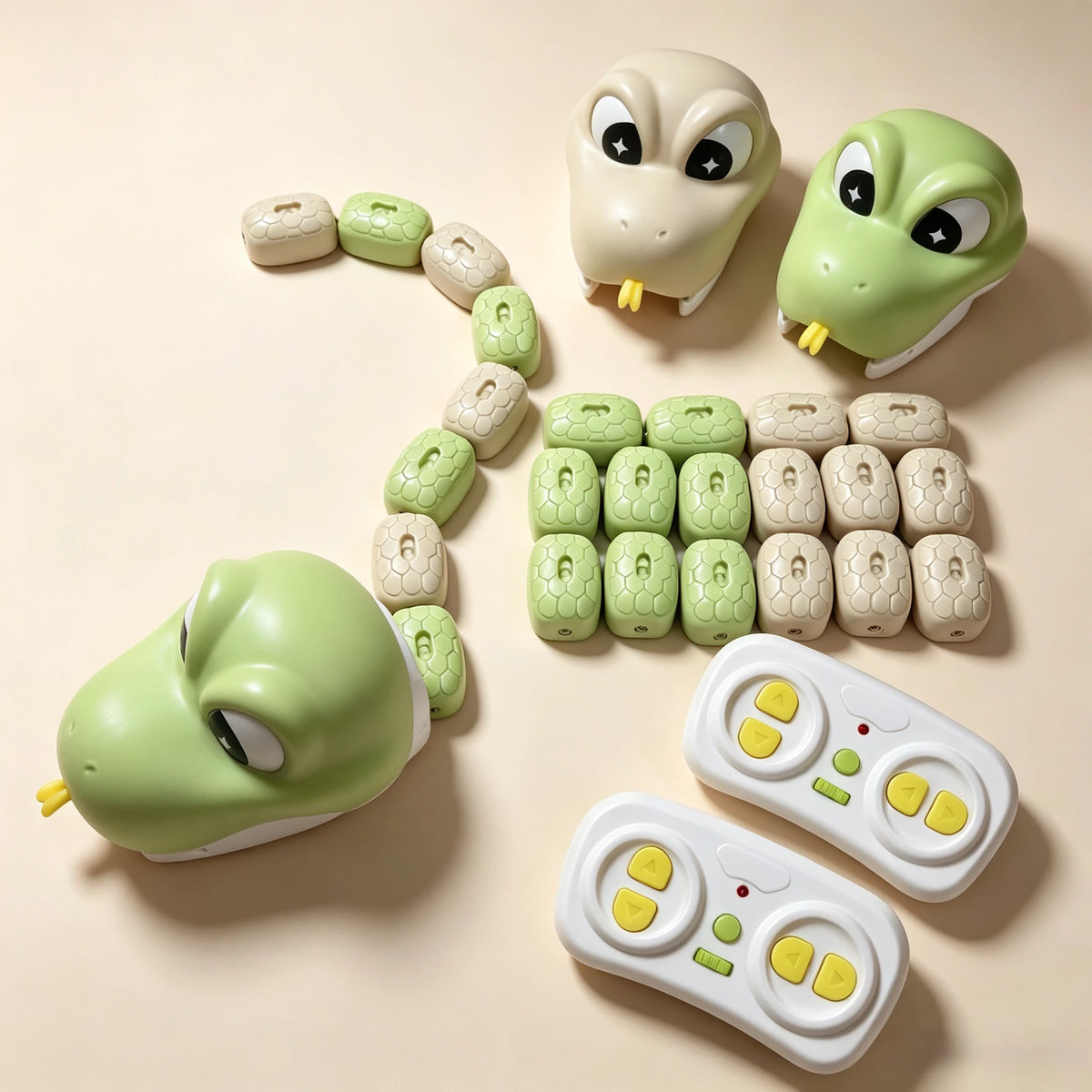 A green plastic snake toy and its remote control are displayed on a light background.