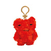 A bright red Fuggler plush monster keychain with a quirky rabbit design.