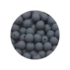 A circular view of numerous small, grey silicone beads of various sizes.