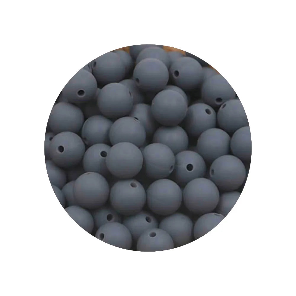 A circular view of numerous small, grey silicone beads of various sizes.