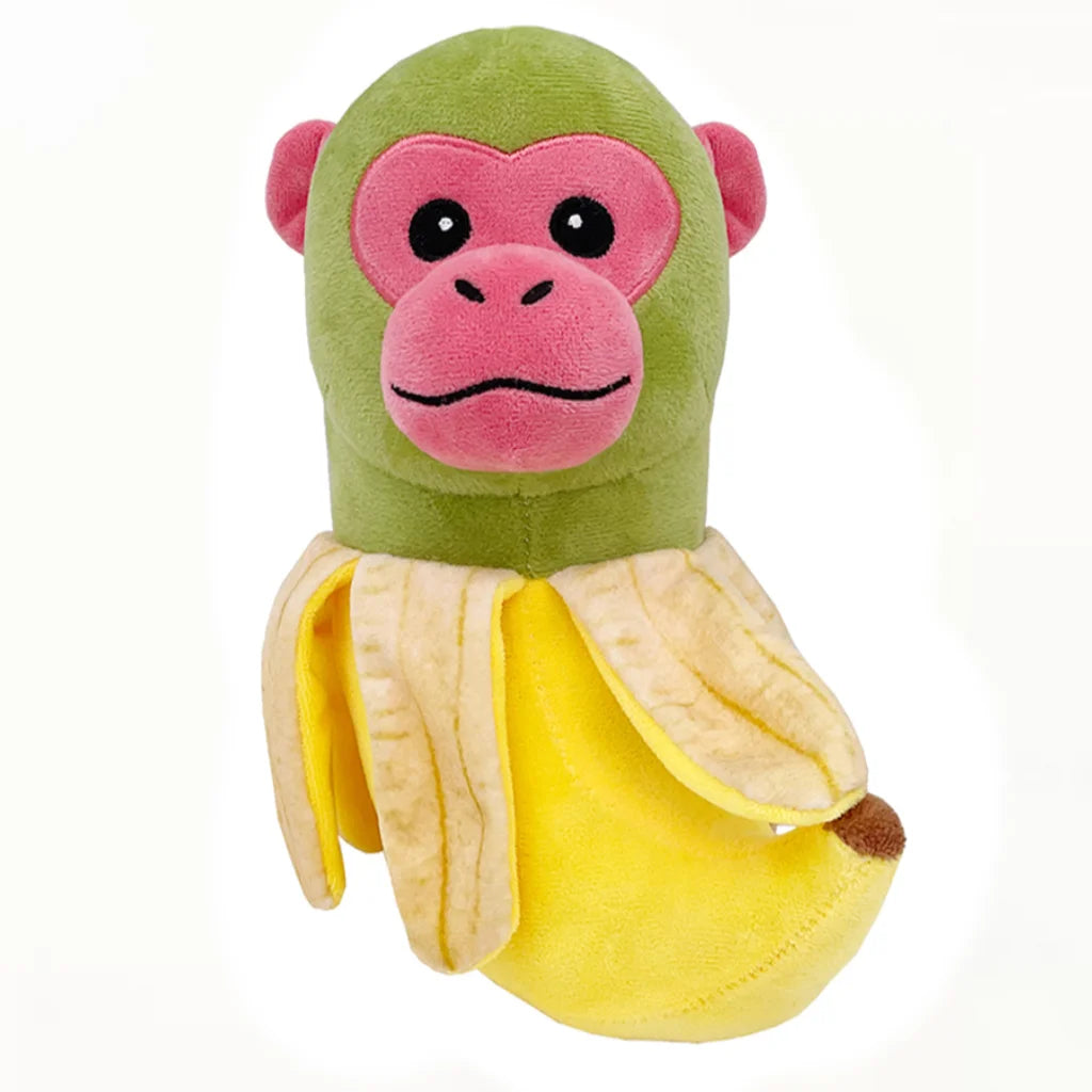A plush toy of a green and pink monkey wearing a yellow banana peel.
