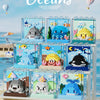A display of clear acrylic building blocks featuring miniature models of ocean animals like sharks, dolphins, and whales.