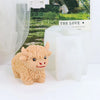A small, fluffy beige silicone mold shaped like a Highland cow is displayed next to a green label.