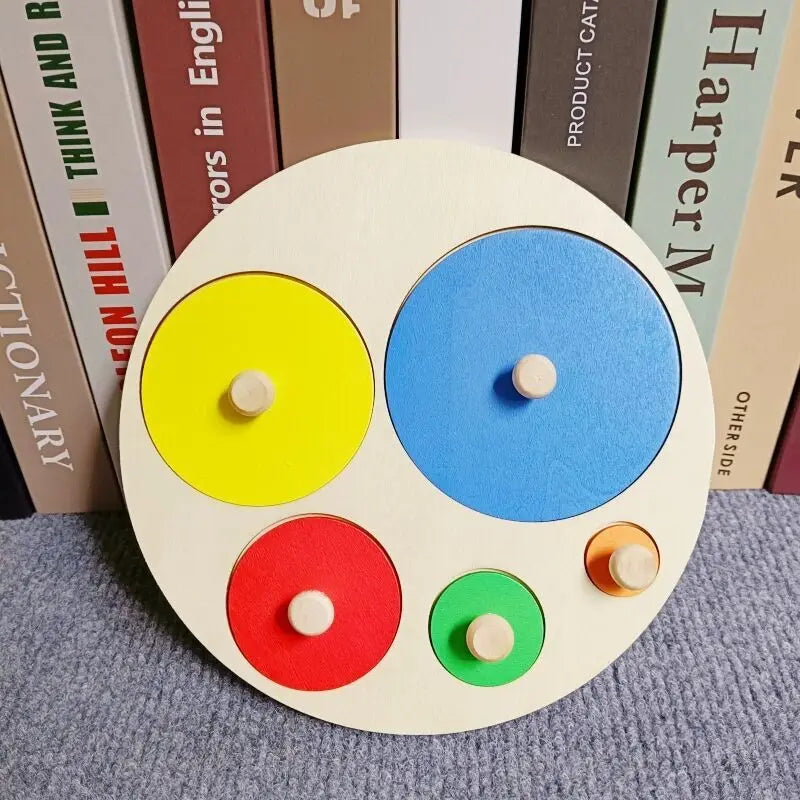 A wooden geometric shape sorter puzzle with colored circles, including yellow, blue, and red.