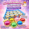 A box of glitter dumpling squishy toys in various colors including pink, yellow, and blue.