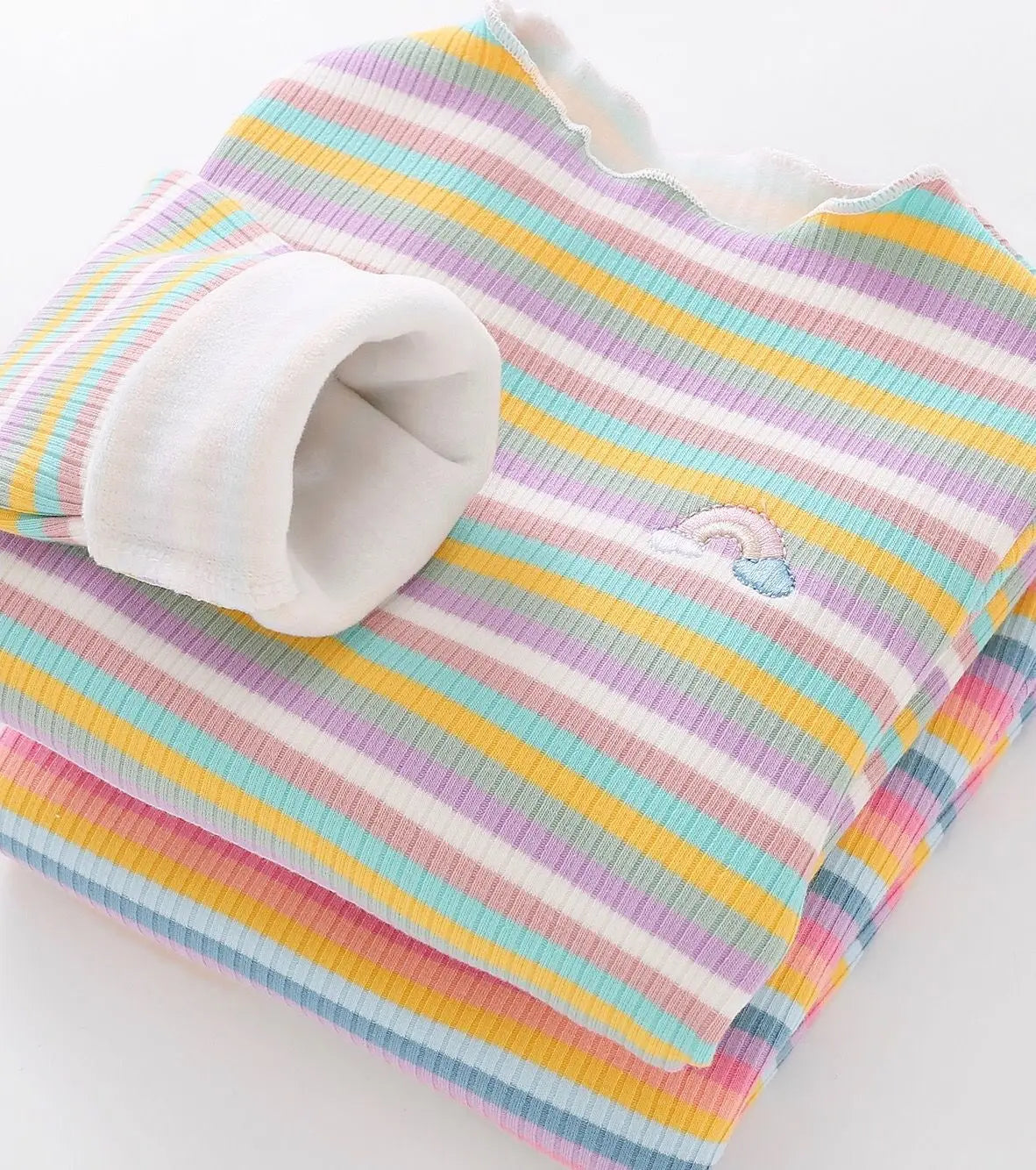 A striped cotton shirt with pink, yellow, and blue stripes and a small rainbow detail.
