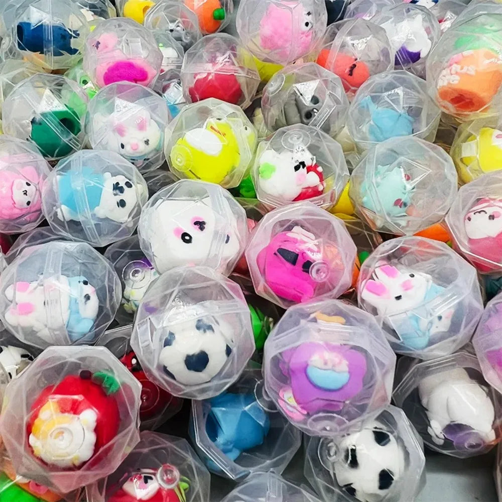 A close-up view of a pack of transparent plastic eggshell party favors in various pastel colors and designs.