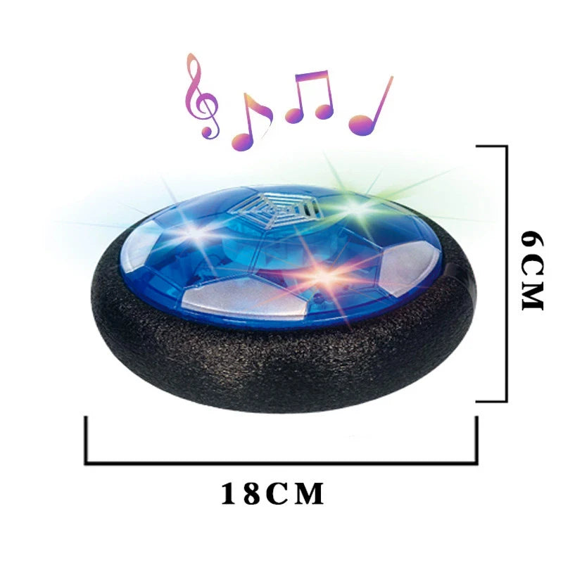A blue glowing LED hover soccer ball resting on a black base with musical notes above it.