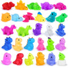 A collection of colorful squishy dinosaur fidget toys in various bright colors like red, yellow, green, blue, and purple.