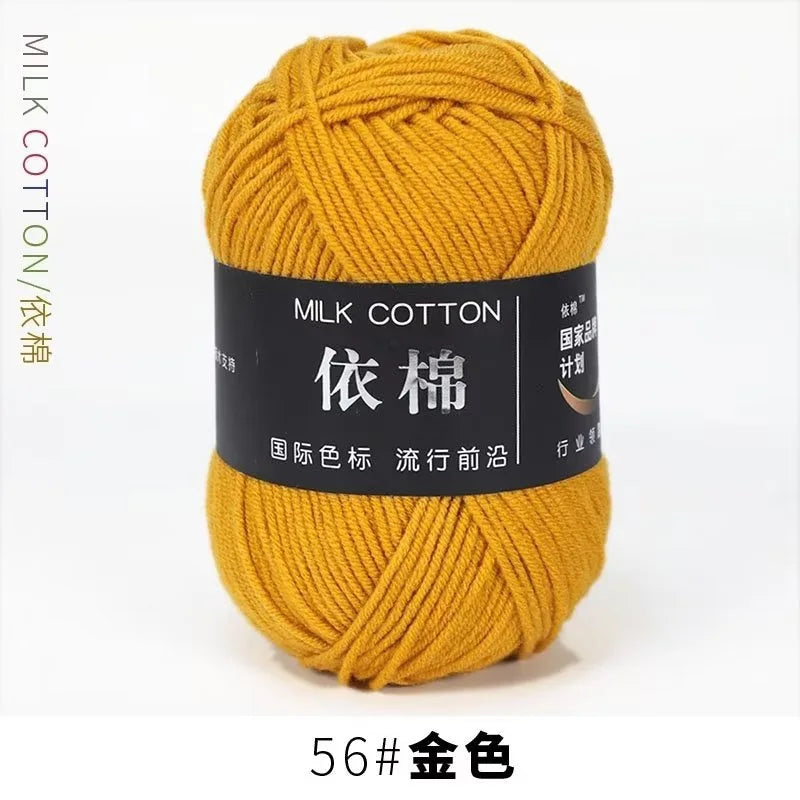 A ball of golden yellow milk cotton yarn labeled 56# gold color for knitting and crochet.