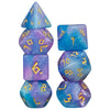 A set of seven glitter polyhedral dice in shades of blue and purple, including a d4, d6, d8, d10, d12, and d20.