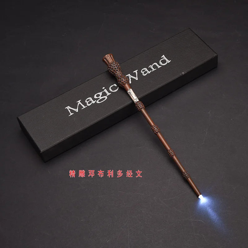 A dark wooden magic wand with an LED light at the tip is displayed on a black surface.