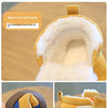 A close-up view of a tan plush-lined winter boot for toddlers, showing the soft suede exterior and interior lining.