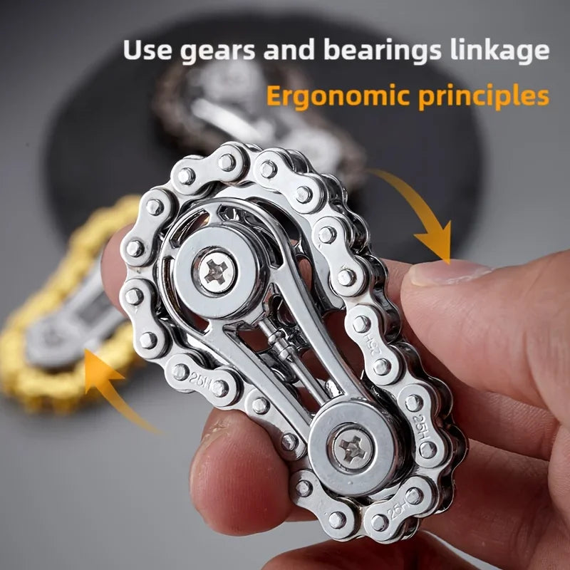 A hand holds a silver metal fidget spinner, demonstrating ergonomic principles for stress relief.
