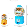 A bright blue candy machine dispenser filled with colorful gumballs and a yellow piggy bank.