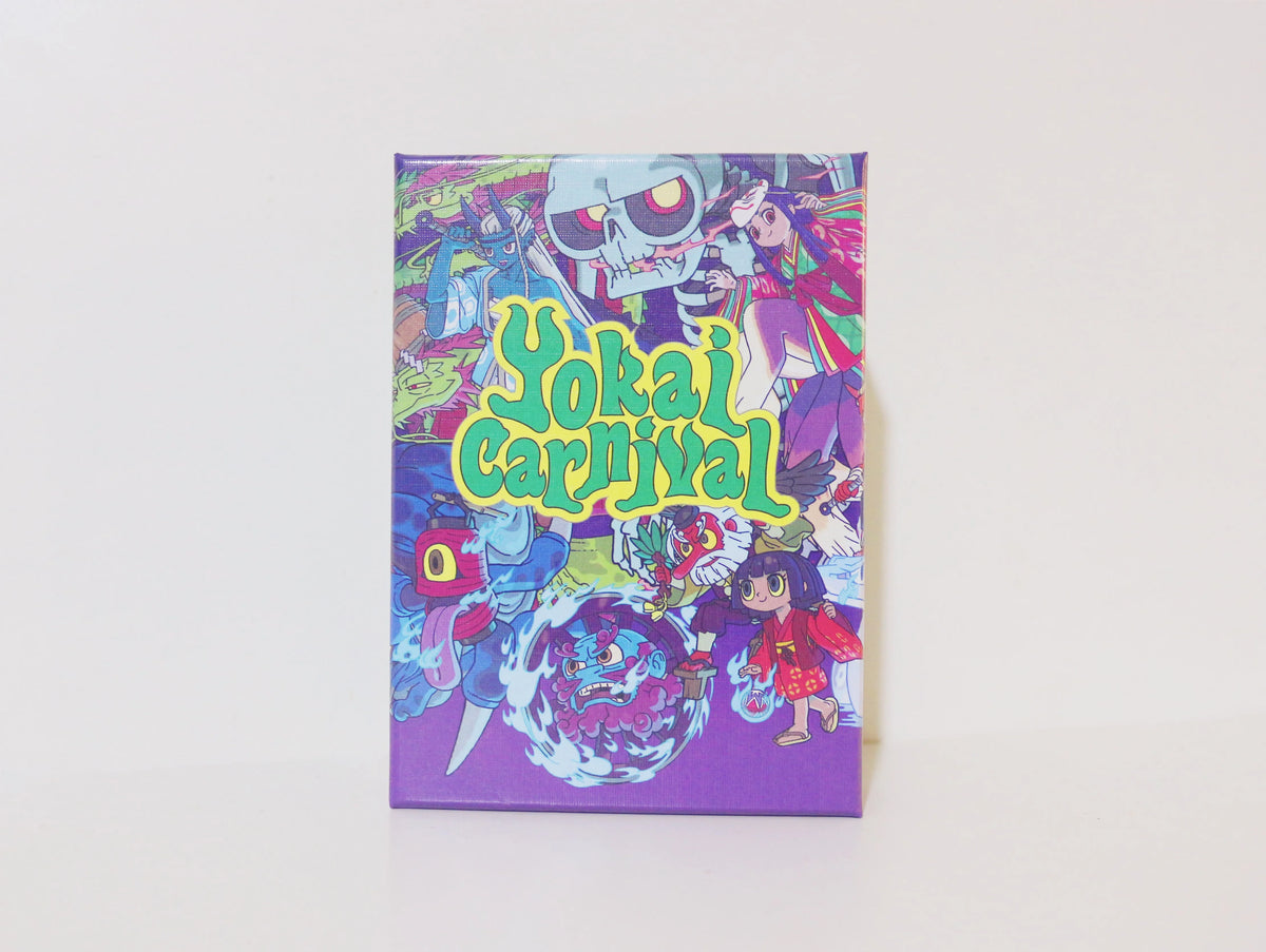 Box art for the Yokai Carnival strategic board game featuring colorful characters and a skull design.