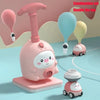 A pink balloon-powered racing car toy set featuring a launcher and a small car model.