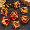 A set of resin dice featuring golden elven numbers on red and clear translucent dice.