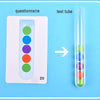 A questionnaire with colored beads and a test tube containing similarly colored beads.