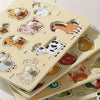 A wooden shape matching puzzle board featuring various animal and vegetable cutouts for early learning.