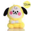 A yellow mini plush keychain resembling a cute anime character with black ears and pink cheeks.