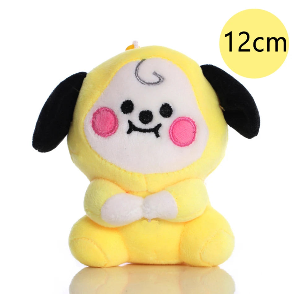 A yellow mini plush keychain resembling a cute anime character with black ears and pink cheeks.