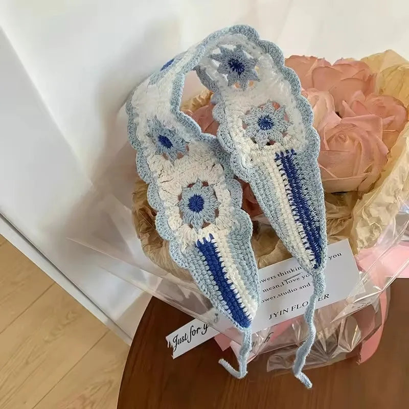 Light blue and white crochet headband featuring a strawberry design