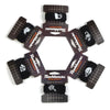 A set of black guitar string dampeners with adjustable tension, arranged in a circle.