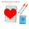 A box of novelty toys resembling cigarette boxes and pipes, with several white plastic pipes displayed next to the packaging.
