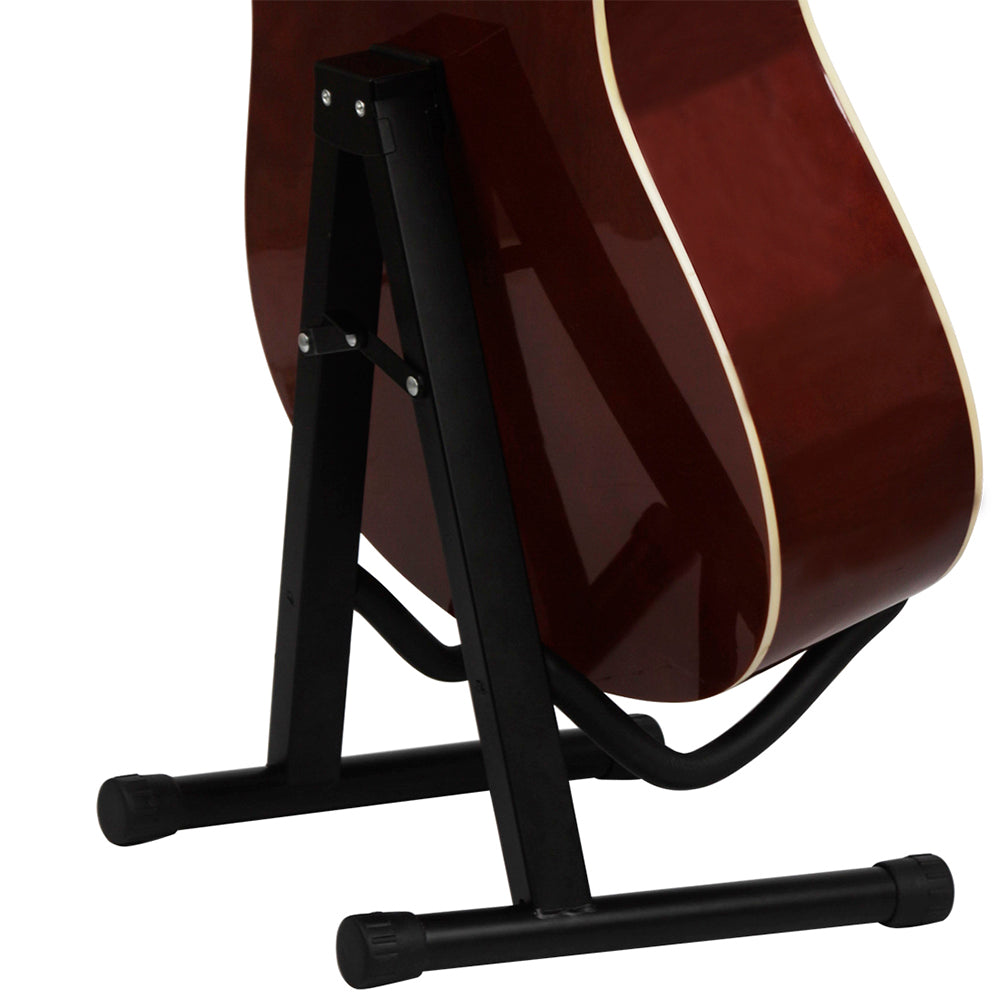 A dark brown acoustic guitar is resting on a black foldable metal stand.