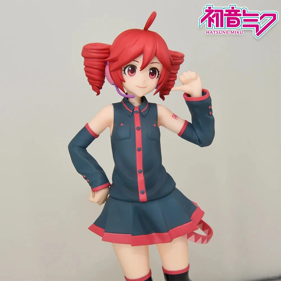 A PVC figure of Hatsune Miku with red hair and a dark blue outfit posing, featuring pink headphones.