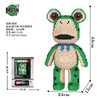 A green bear figure made of micro building blocks with large eyes and a blue collar.